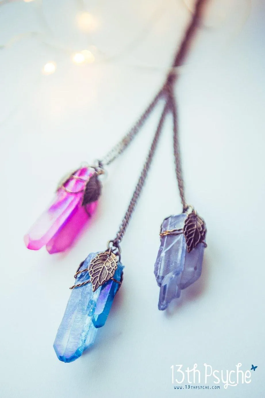 Colorful raw quartz crystal point pendant necklace with leaves